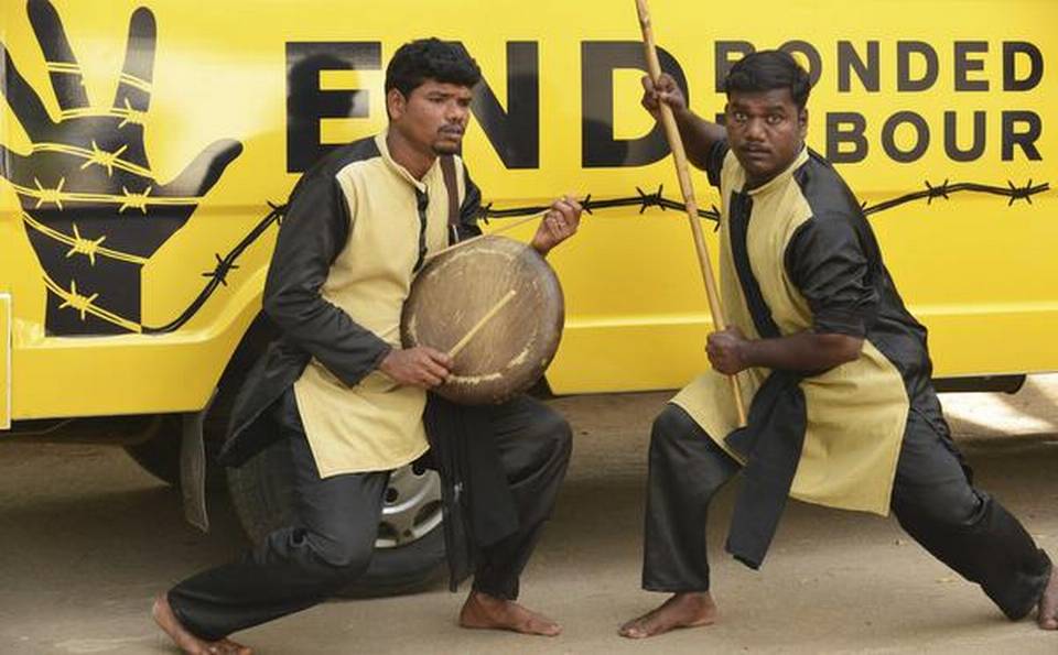 ile photo of a cultural troupe performing street plays as part of a campaign against bonded labour.