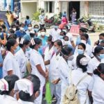 Nurses recruited for Covid-19 duty at the Government Kilpauk Medical College Hospital protest on the Directorate of Medical Education campus on Monday