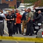 A Forsyth County Sheriff directs law enforcement officers on the scene at Mount Tabor High School on Sept. 1, 2021 in Winston-Salem, N.C.